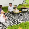 Mesa de Camping Plegable con Laterales Abatibles Altura Ajustable y Encimera Metálica de Rejilla 137x62x67 cm Negro - Ogal.Es